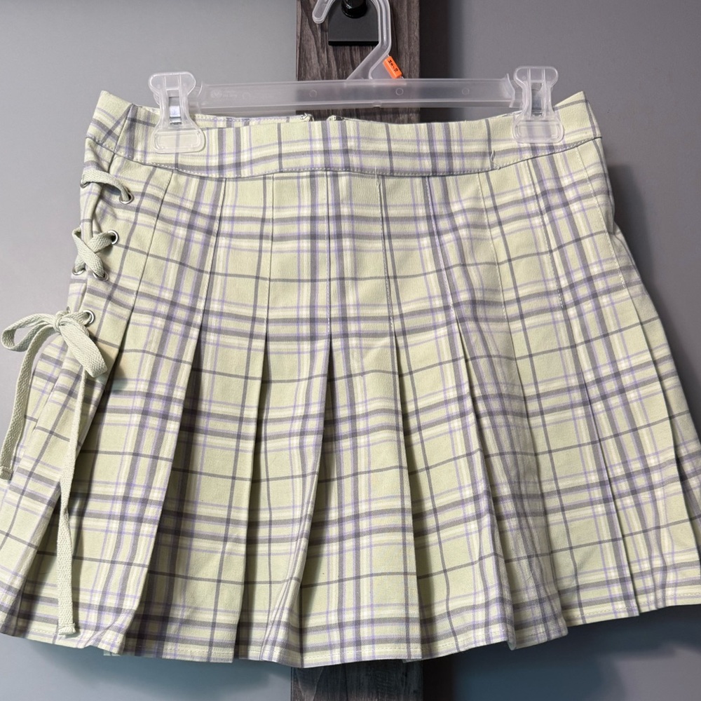 Pastel yellow pleated mini skirt. Forever 21. Barely worn if at all.